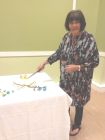 President, Lindsay Entwistle, cutting the birthday cake